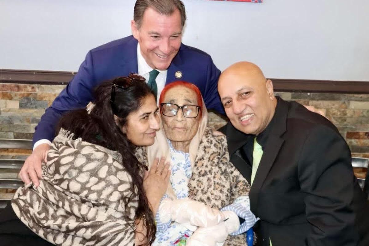Suozzi with Supercentarian Sardar Khatoon and family