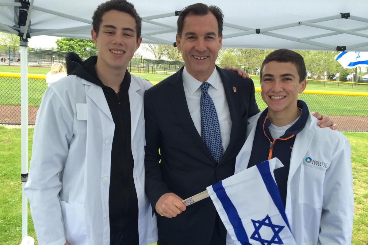 Rep Tom Suozzi with Omer Neutra (left) and Daniel Neutra (right)