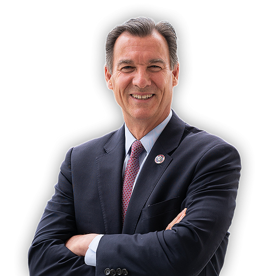 Photo of Congressman Suozzi with arms folded